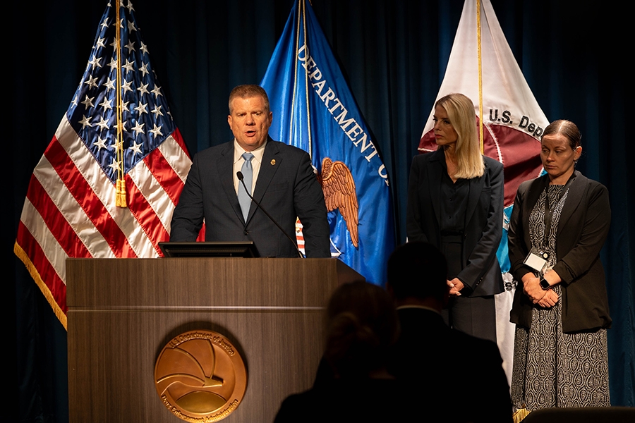 DEA Acting Administrator Robert J. Murphy delivers remarks from a podium at the Drug Enforcement Administration Headquarters. He is joined by Attorney General Pamela Bondi.
