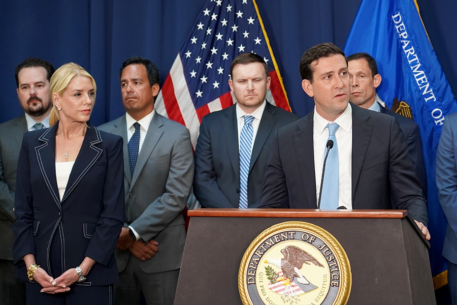 Acting Assistant Attorney General Matthew R. Galeotti of the Justice Department’s Criminal Division delivers remarks from a podium at the U.S. Attorney’s Office for the Eastern District of New York. He is joined by federal government officials.