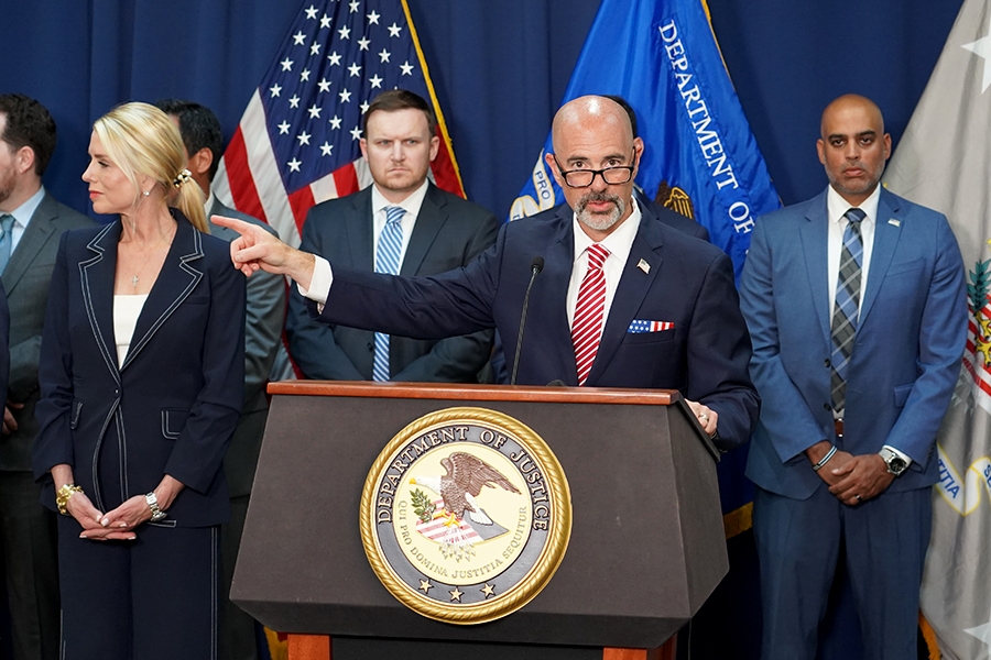 Administrator Terrance Cole of the Drug Enforcement Administration (DEA) delivers remarks from a podium at the U.S. Attorney’s Office for the Eastern District of New York. He is joined by federal government officials.
